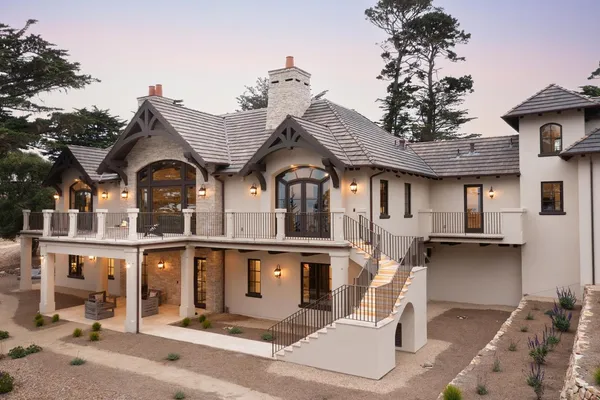 a view of backyard with outdoor seating a patio and plants
