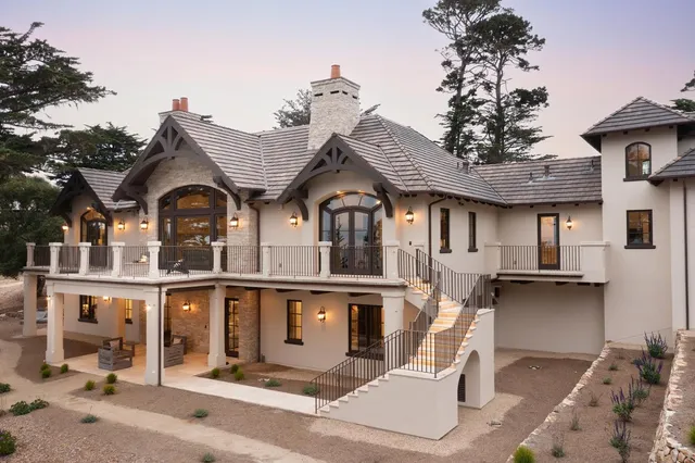 a view of backyard with outdoor seating a patio and plants