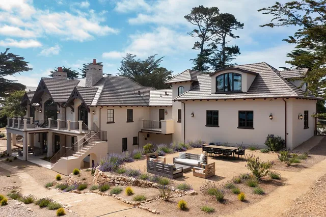 a view of a house with snow on the road