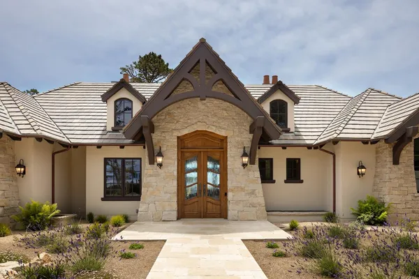 a front view of a house with garden