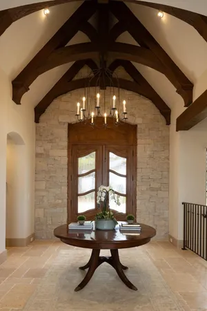 a room with pool table and windows