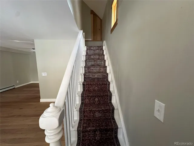 a view of entryway with wooden floor
