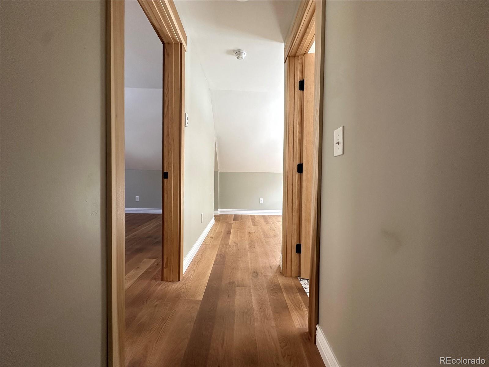 900 Rose Street Georgetown, CO 80444 - Photo 17 of 23 a view of a hallway with wooden floor