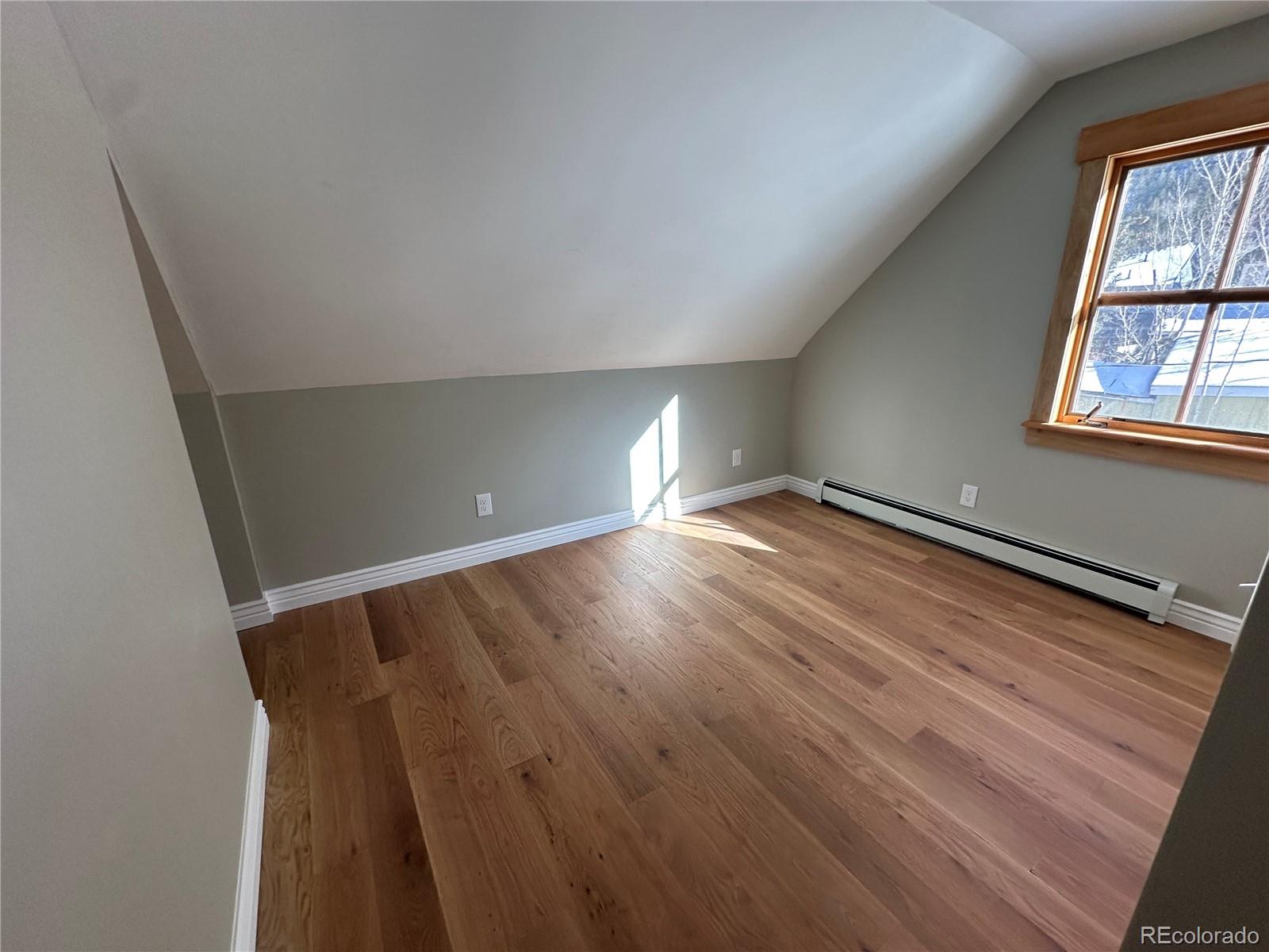 900 Rose Street Georgetown, CO 80444 - Photo 19 of 23 wooden floor in an empty room with a window