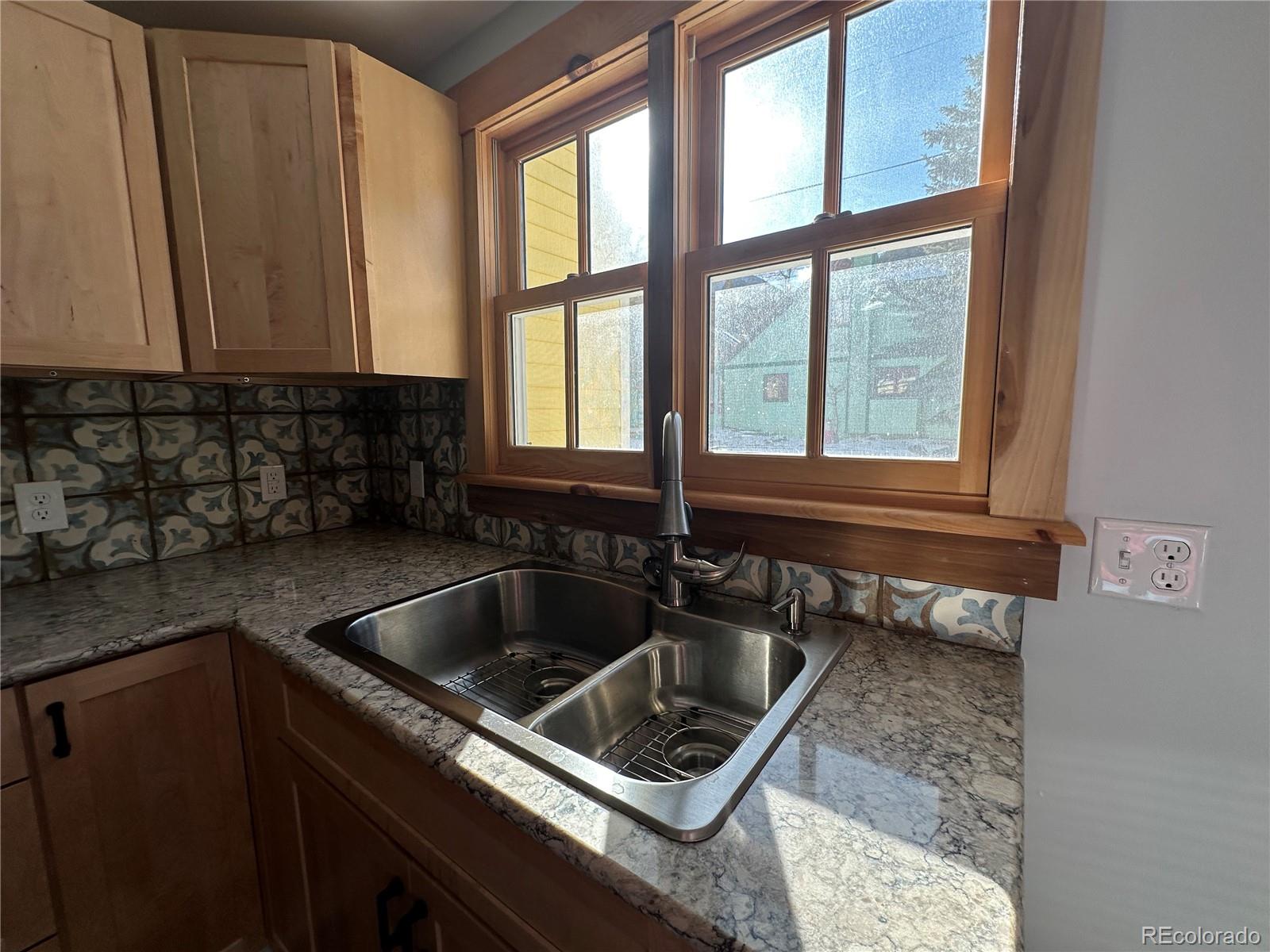 900 Rose Street Georgetown, CO 80444 - Photo 9 of 23 a kitchen sink with a stove and cabinets