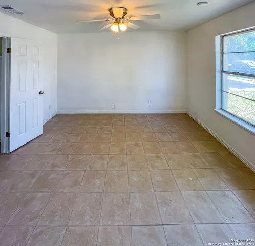a view of an empty room with a window