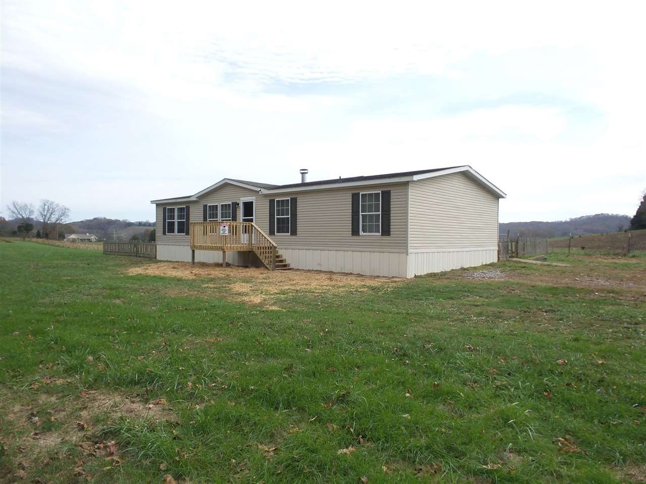 1734 Mars Hill Road Spring City, TN 37381 - Photo 1 of 1 a view of a house with a backyard