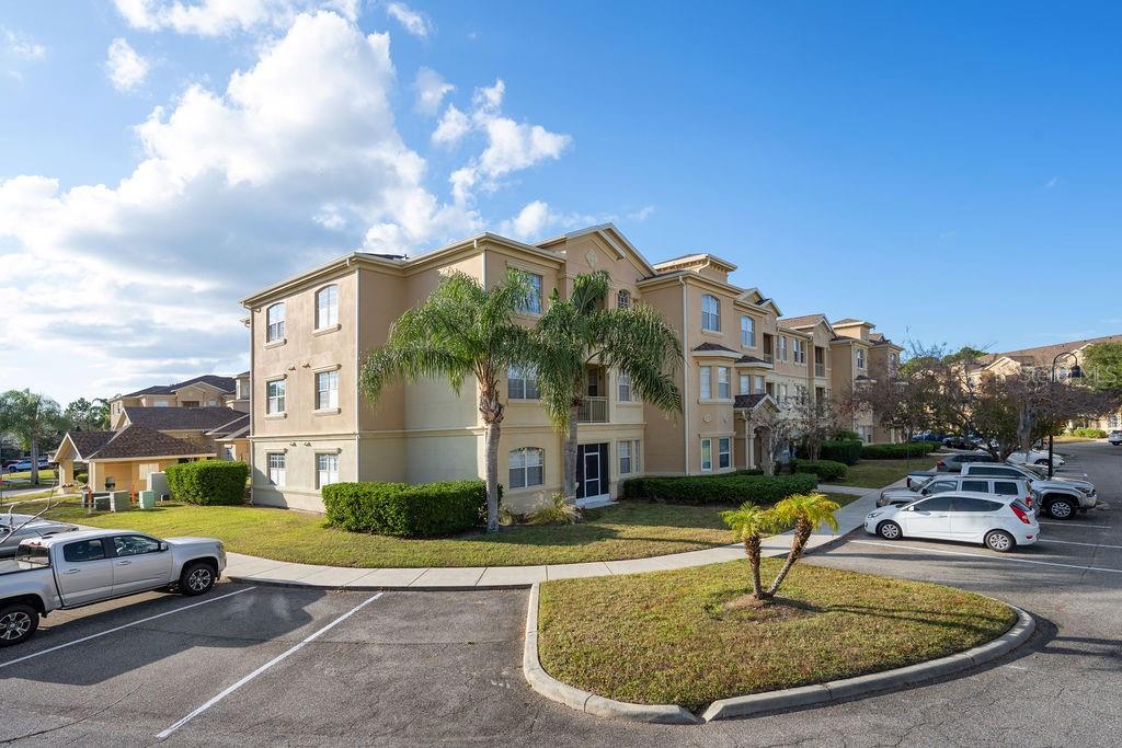 302 Terrace Ridge Circle, Unit 302 Davenport, FL 33896 - Photo 22 of 23 a view of a fountain in front of a building