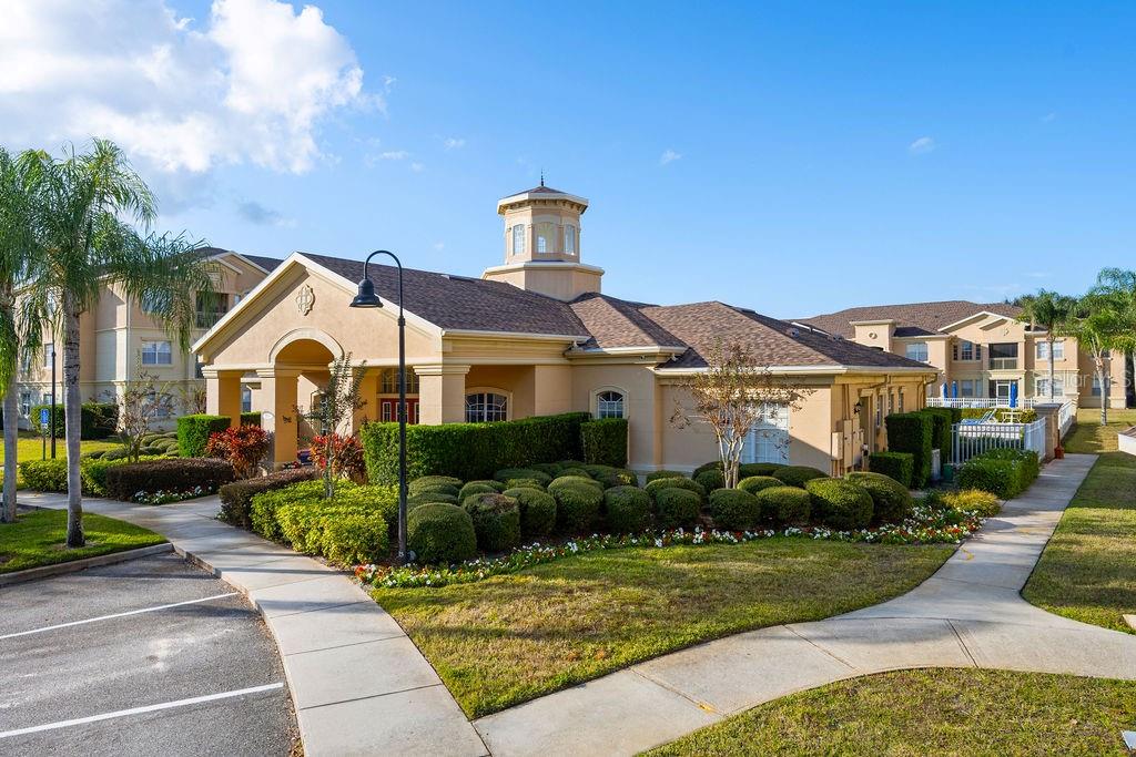302 Terrace Ridge Circle, Unit 302 Davenport, FL 33896 - Photo 23 of 23 a front view of a house with garden