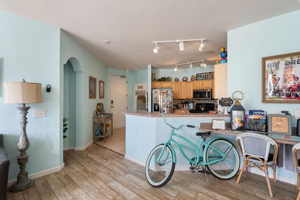 302 Terrace Ridge Circle, Unit 302 Davenport, FL 33896 - Photo 4 of 23 a kitchen with a table and chairs in it