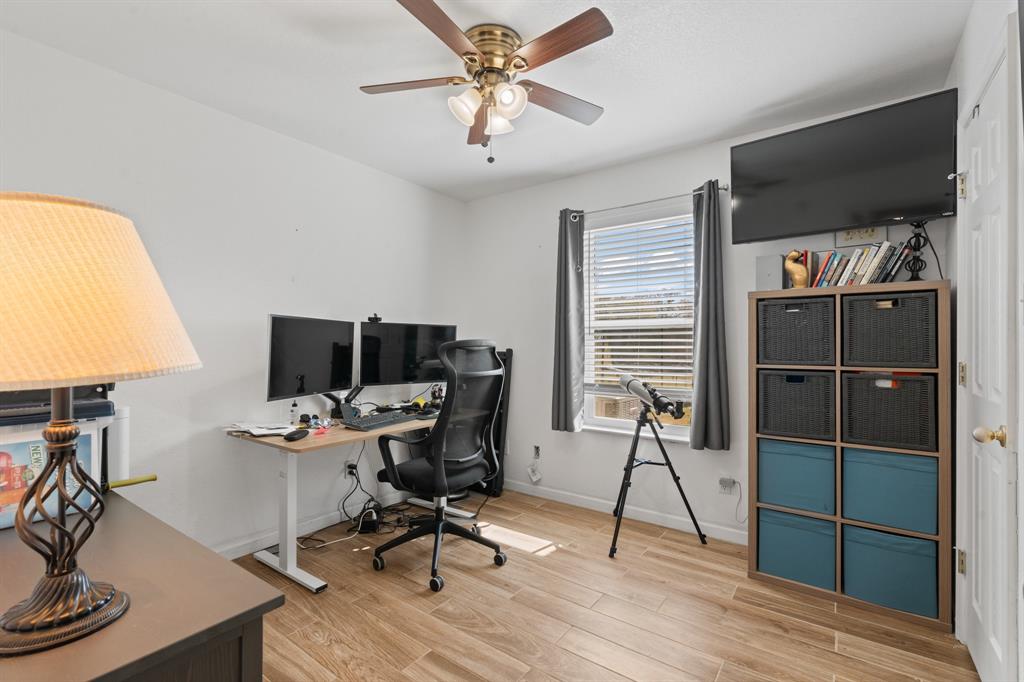 1013 Highland Road Cleburne, TX 76033 - Photo 17 of 33 a view of a workspace with furniture and a window