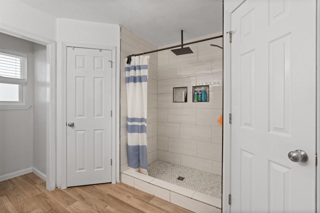 1013 Highland Road Cleburne, TX 76033 - Photo 25 of 33 a bathroom with a shower