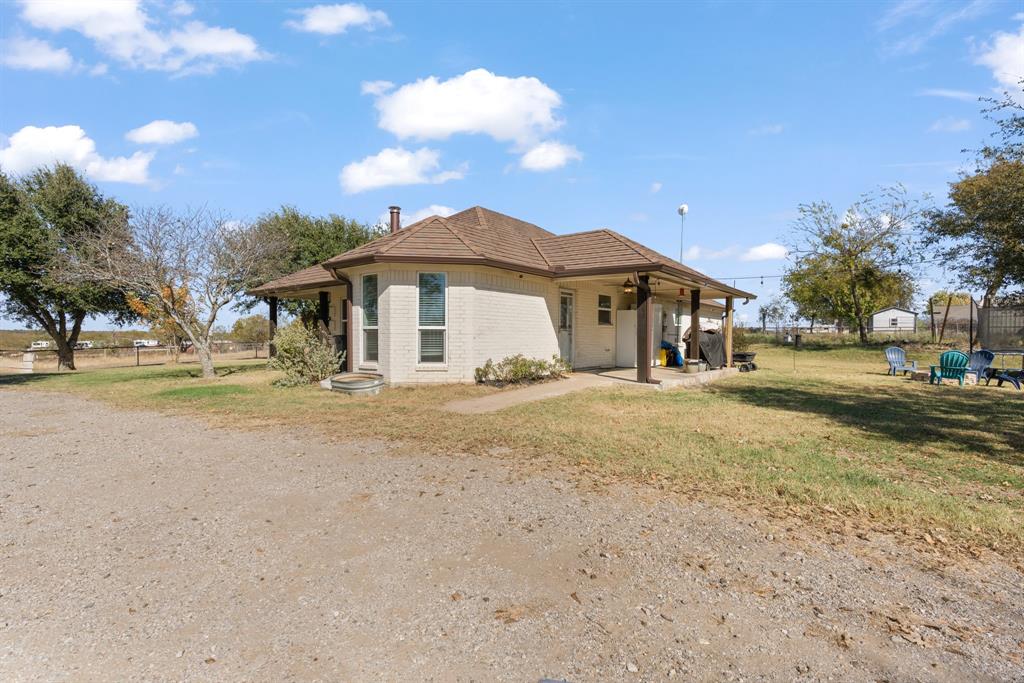 1013 Highland Road Cleburne, TX 76033 - Photo 29 of 33 a front view of a house with a yard