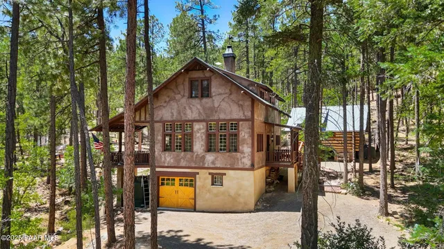 a view of a house with yard and sitting area