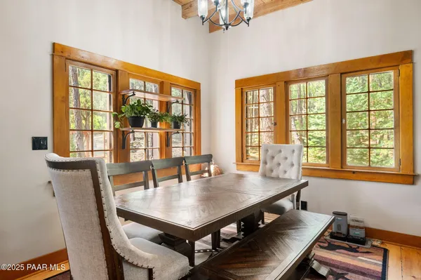 a view of a dining room with furniture window and outside view