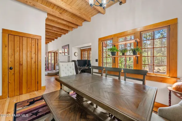 a living room with furniture and large window