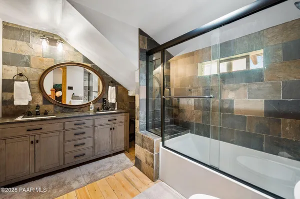 a bathroom with a sink a vanity and a mirror