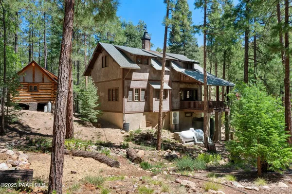 a front view of house with a garden