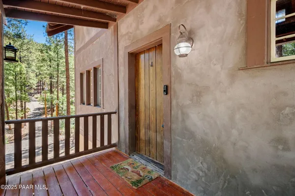 a view of a porch with wooden floor