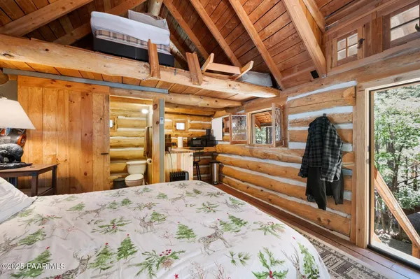 a bed room with a bed and a view of bedroom