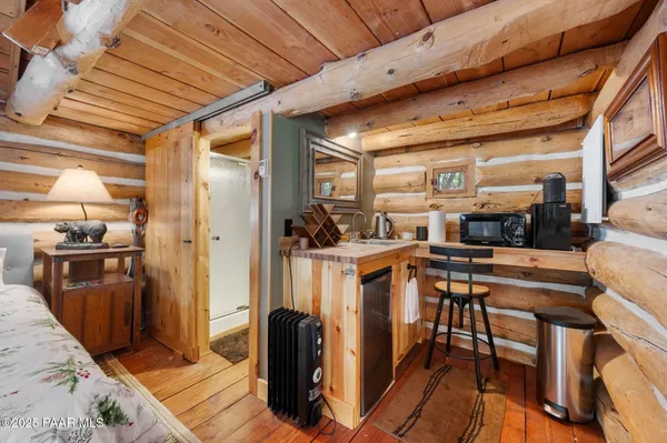 a kitchen with table and chairs