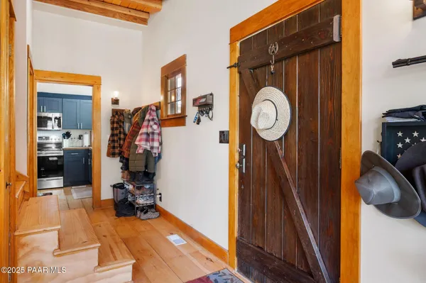 a view of living room with furniture and entryway