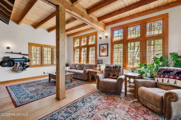 a living room with furniture and a rug