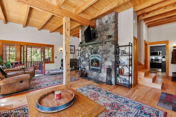 a very nice looking living room with a couch and a fireplace