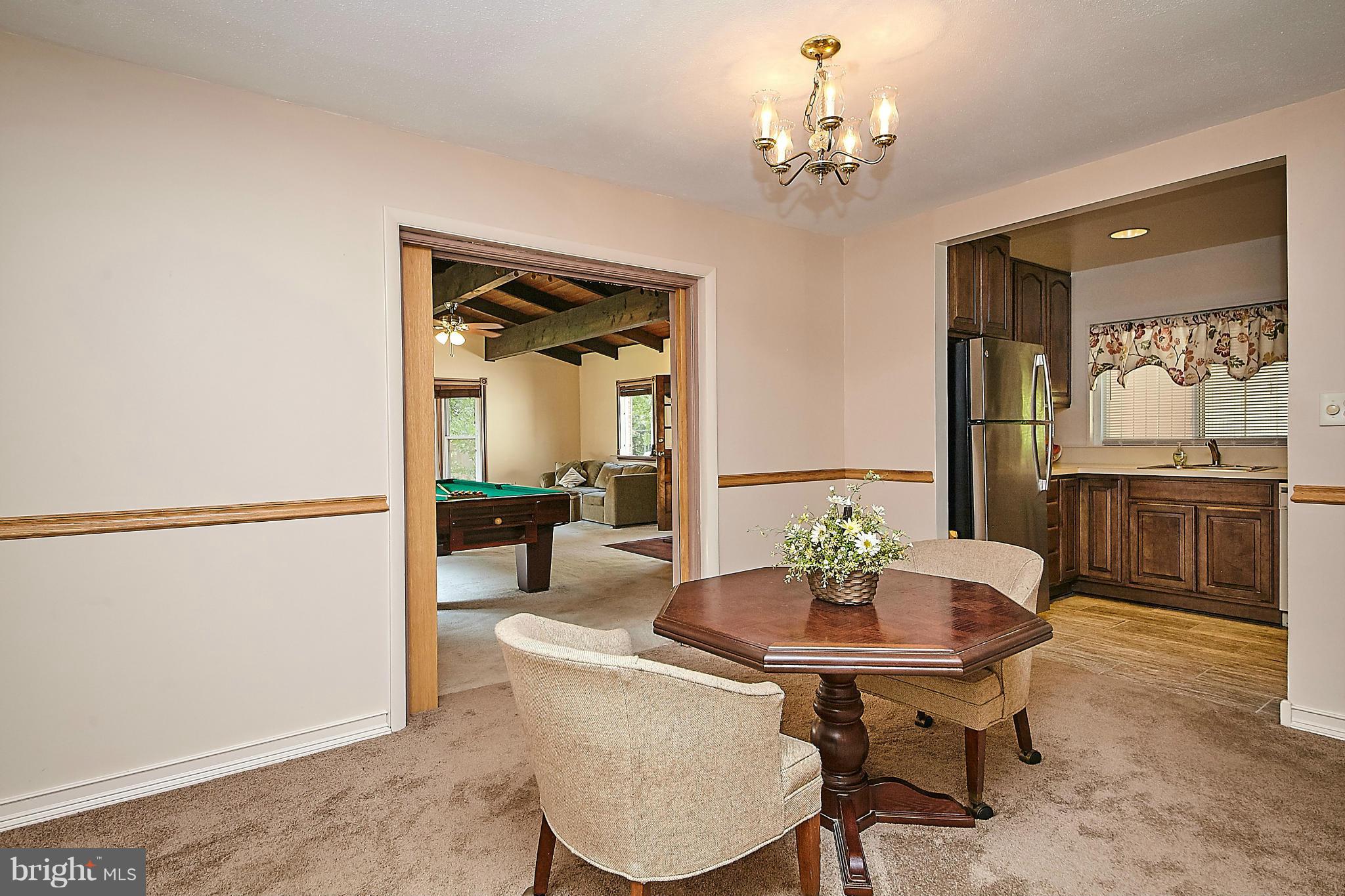 5540 Earlehurst Street Springfield, VA 22151 - Photo 11 of 30 a view of a dining room with furniture and wooden floor