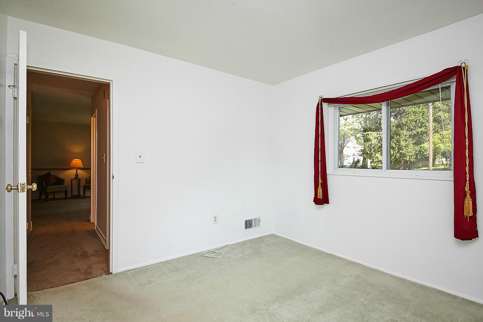 5540 Earlehurst Street Springfield, VA 22151 - Photo 21 of 30 a view of a hallway with a window