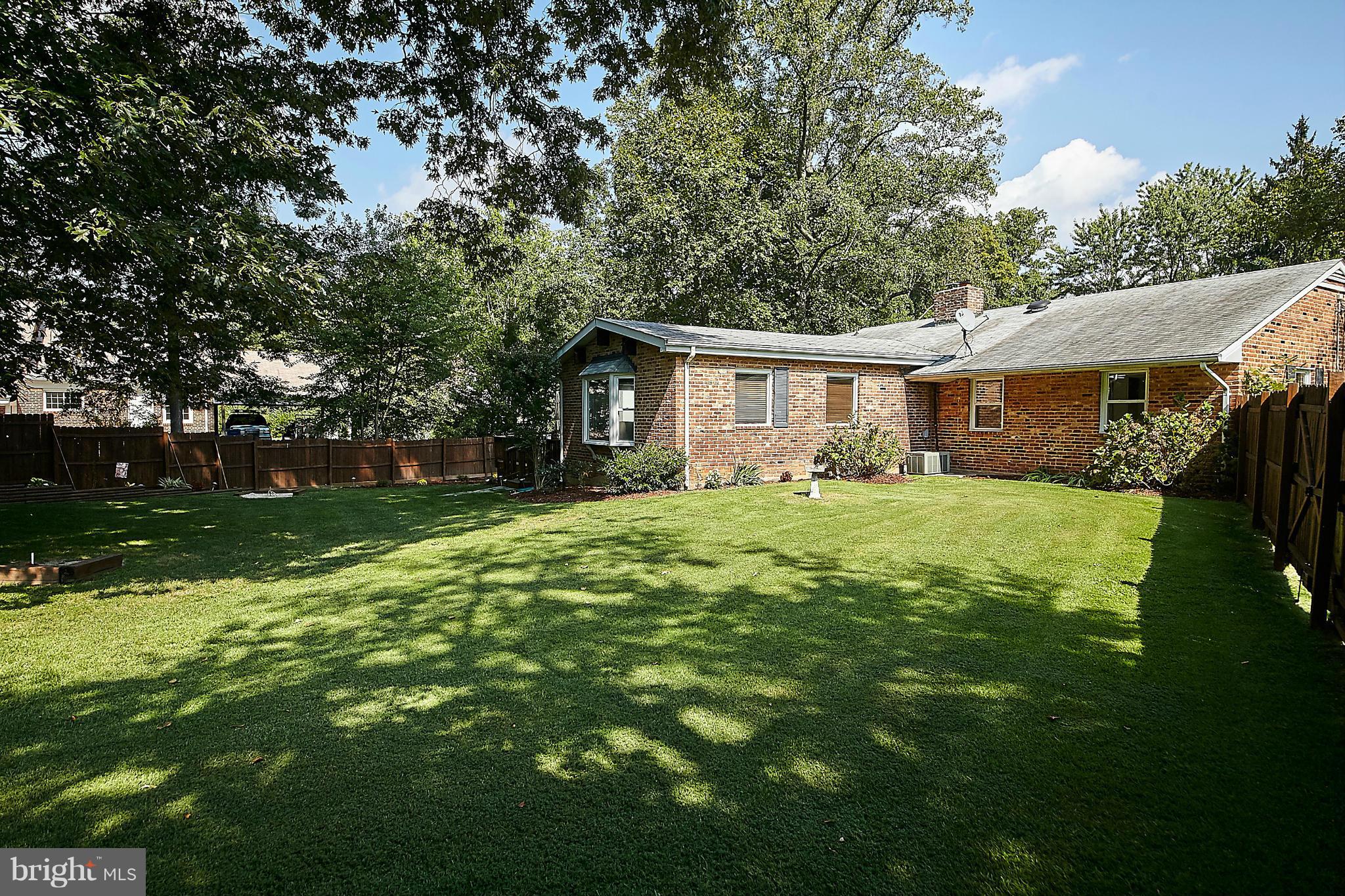 5540 Earlehurst Street Springfield, VA 22151 - Photo 27 of 30 a front view of house with yard and green space