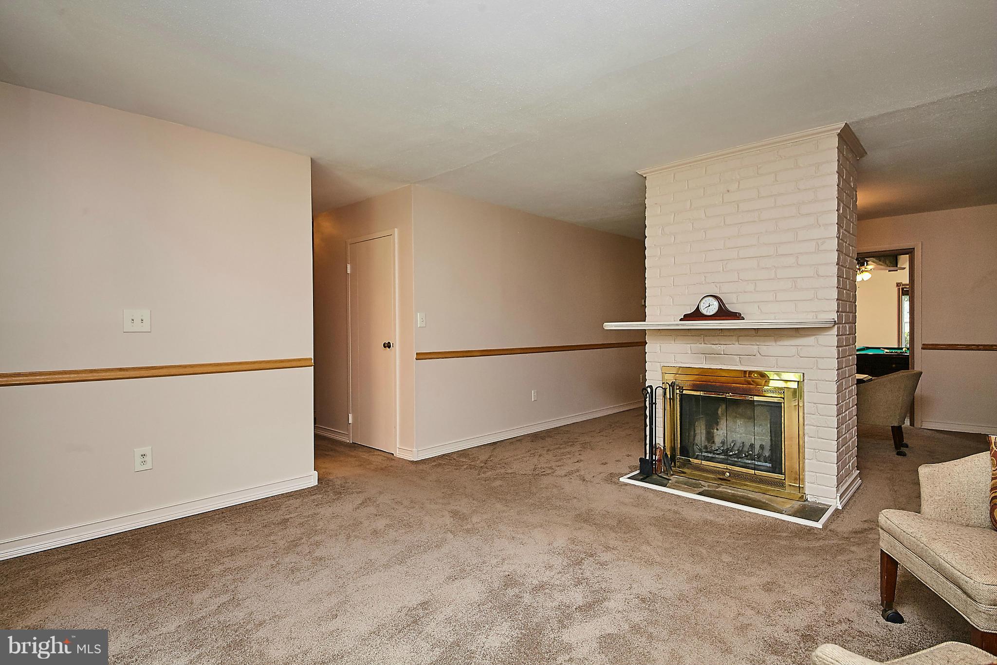 5540 Earlehurst Street Springfield, VA 22151 - Photo 5 of 30 a view of an empty room with a fireplace