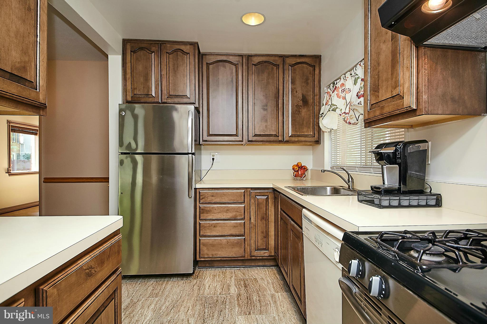 5540 Earlehurst Street Springfield, VA 22151 - Photo 8 of 30 a kitchen with a refrigerator sink and stove