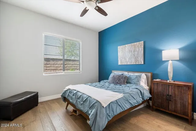 a bedroom with a bed and window