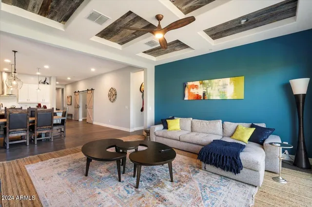 a living room with furniture and a rug