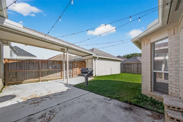a view of a backyard of the house