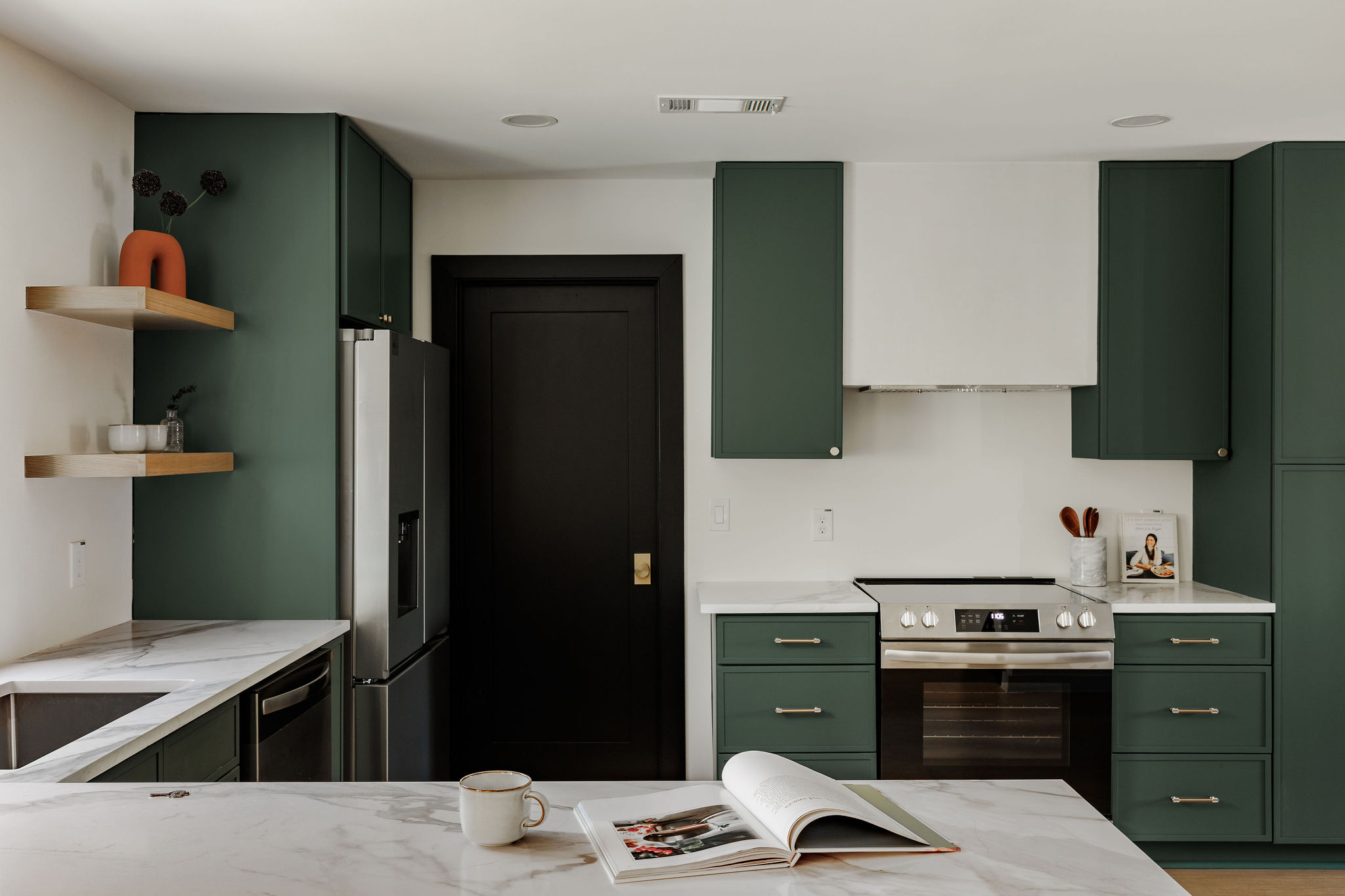2210 Comburg Castle Way Austin, TX 78748 - Photo 17 of 40 a kitchen with stainless steel appliances kitchen island a refrigerator stove and sink