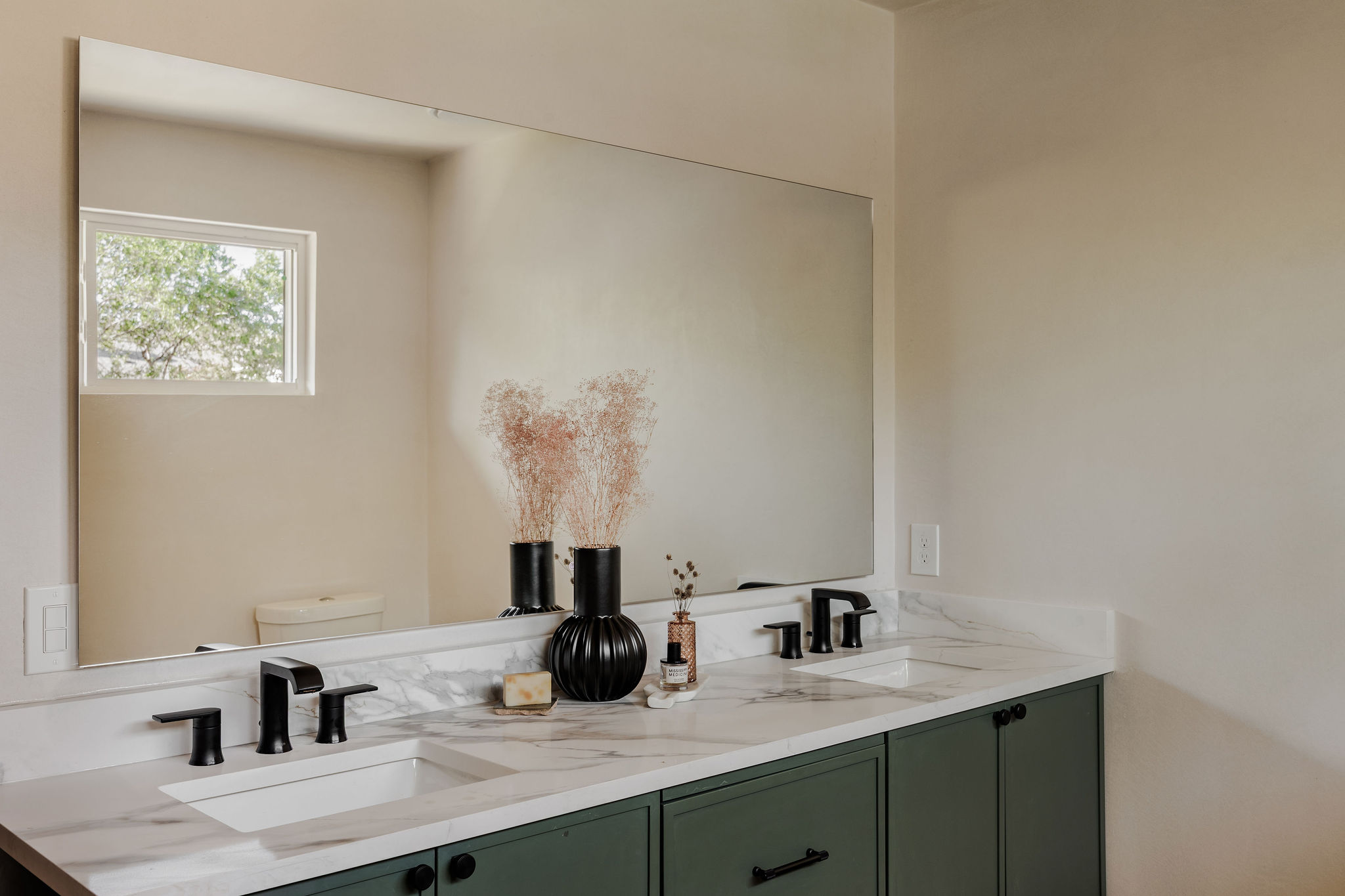 2210 Comburg Castle Way Austin, TX 78748 - Photo 30 of 40 a bathroom with a double vanity sink and a mirror