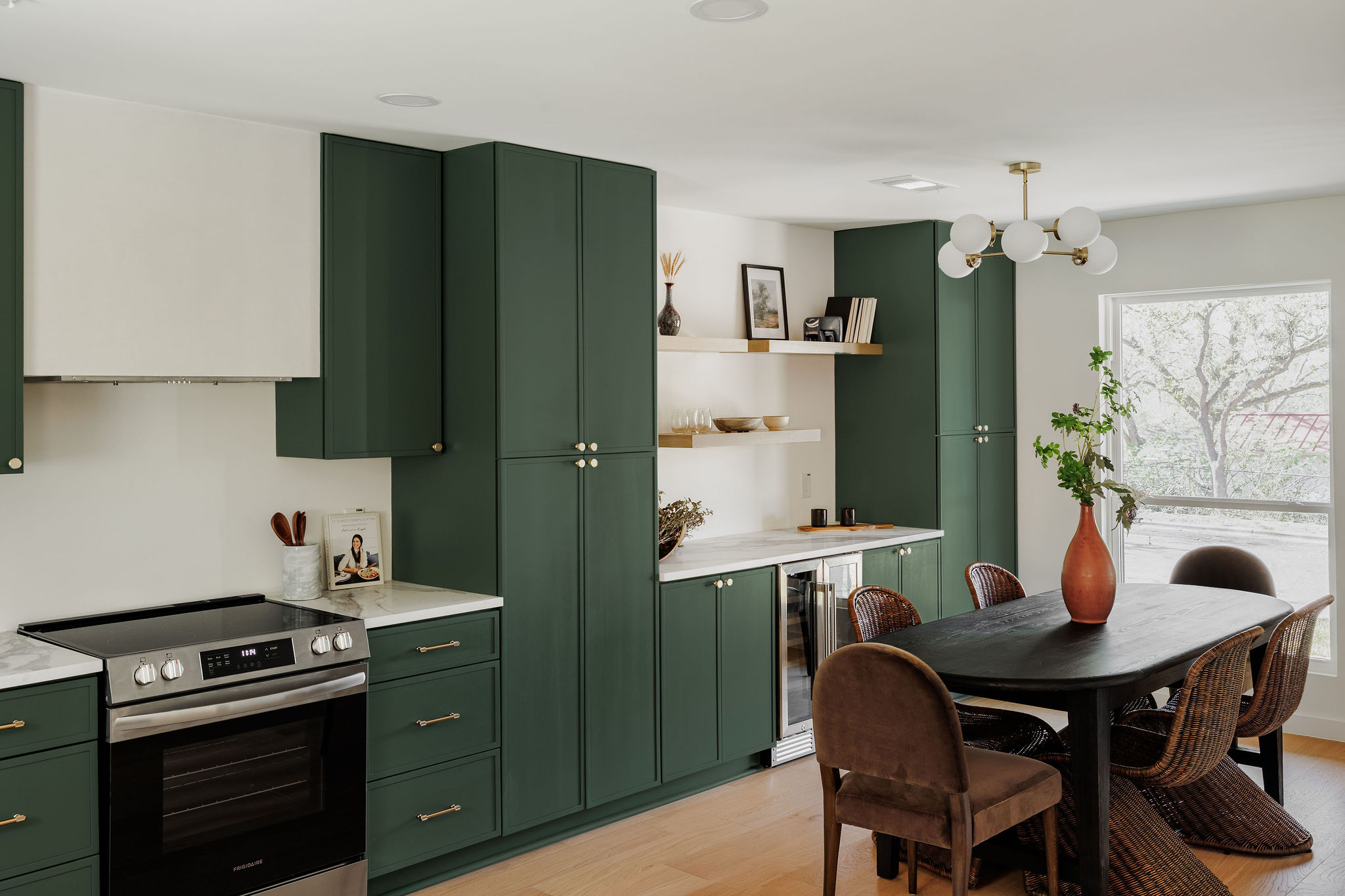 2210 Comburg Castle Way Austin, TX 78748 - Photo 5 of 40 a kitchen with stainless steel appliances a dining table and chairs