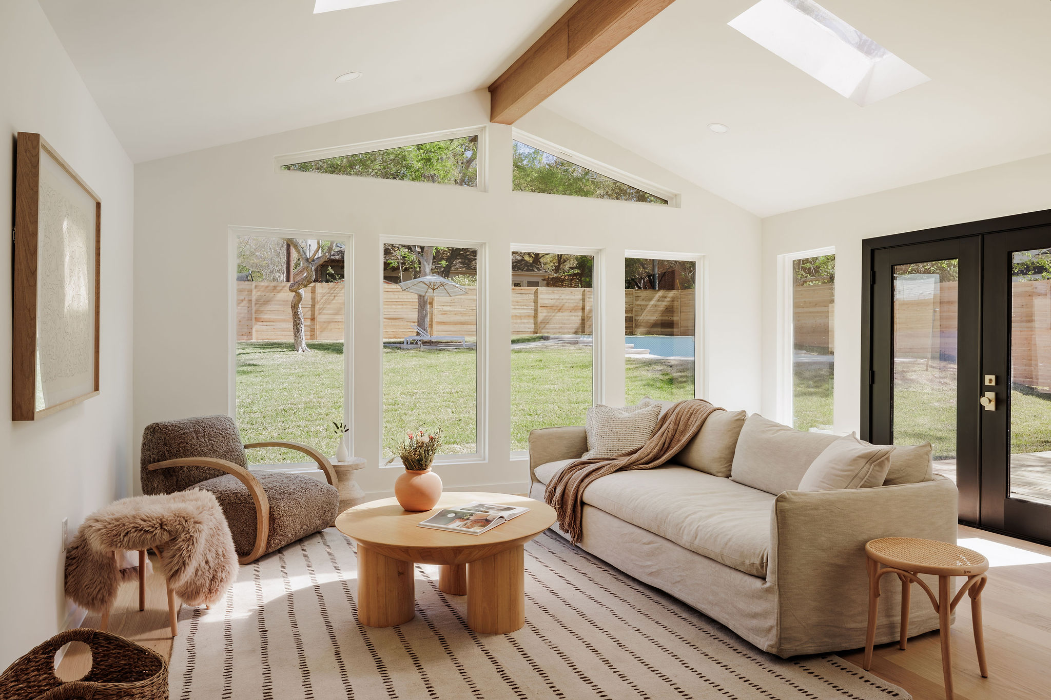2210 Comburg Castle Way Austin, TX 78748 - Photo 10 of 40 a living room with furniture and floor to ceiling windows