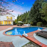 a view of a swimming pool with lounge chair
