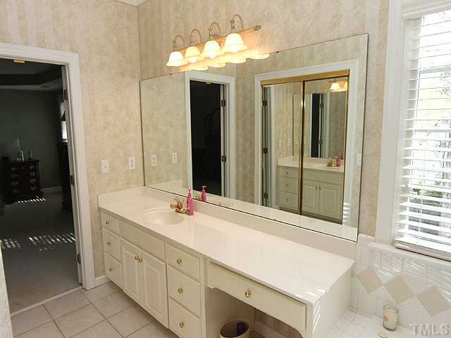 9404 Stone Mountain Road Raleigh, NC 27613 - Photo 10 of 25 Master Bathroom Features Tile Flooring, Whirlpool Tub and Separate Shower! THERE IS ALSO A SEPARATE SINK AREA ON OTHER SIDE OF THE MASTER BATHROOM!!!!