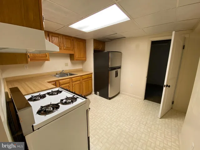a kitchen with a stove and a refrigerator