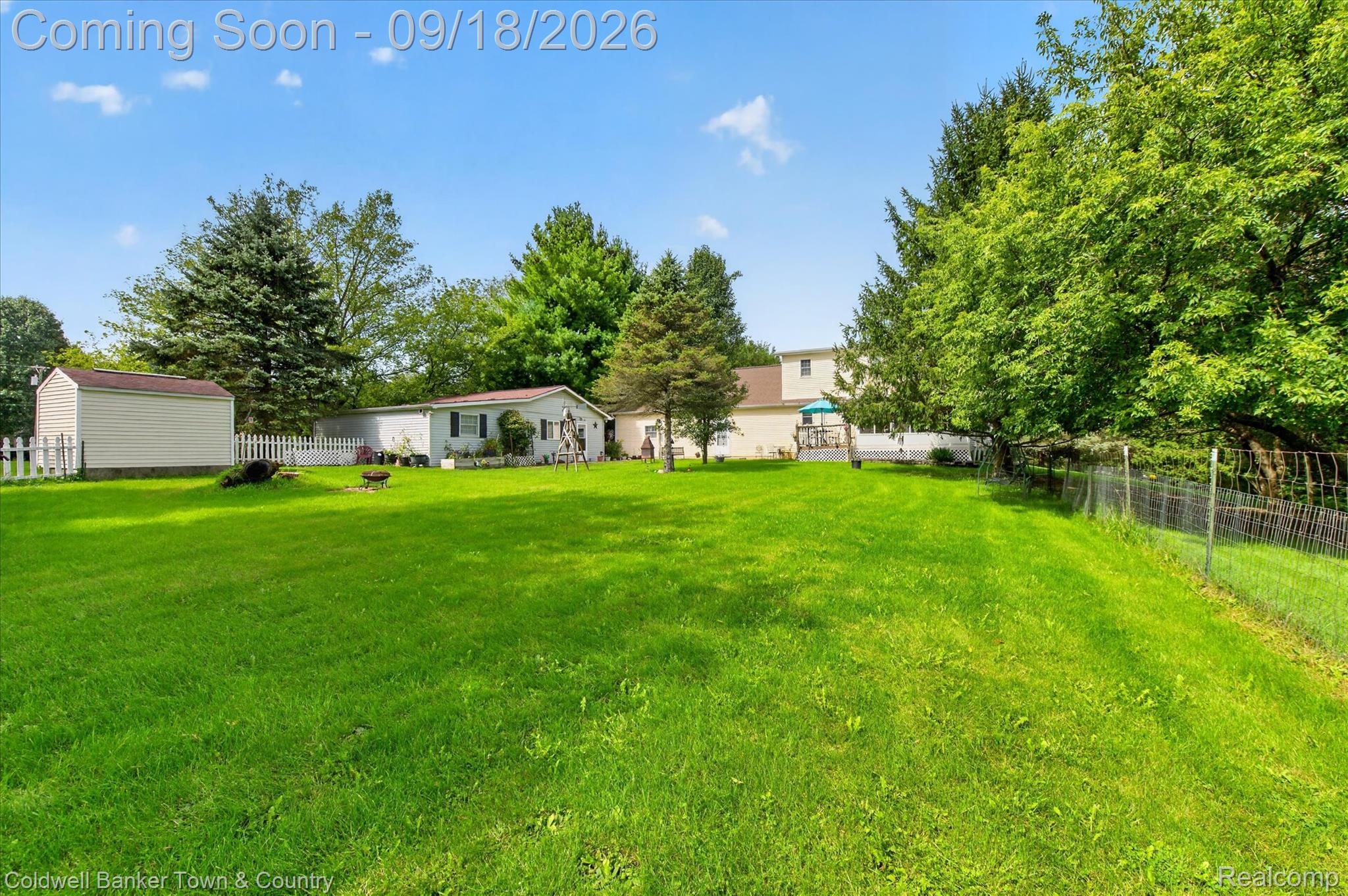 4442 McGunn Road Howell, MI 48843 - Photo 50 of 63 Expansive green lawn with mature trees and a fenced property line