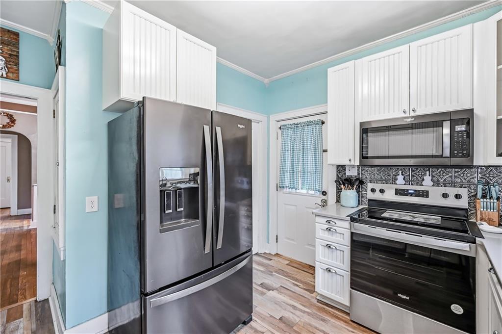 2411 Graceland Road New Castle, PA 16105 - Photo 12 of 50 a kitchen with a refrigerator stove and microwave