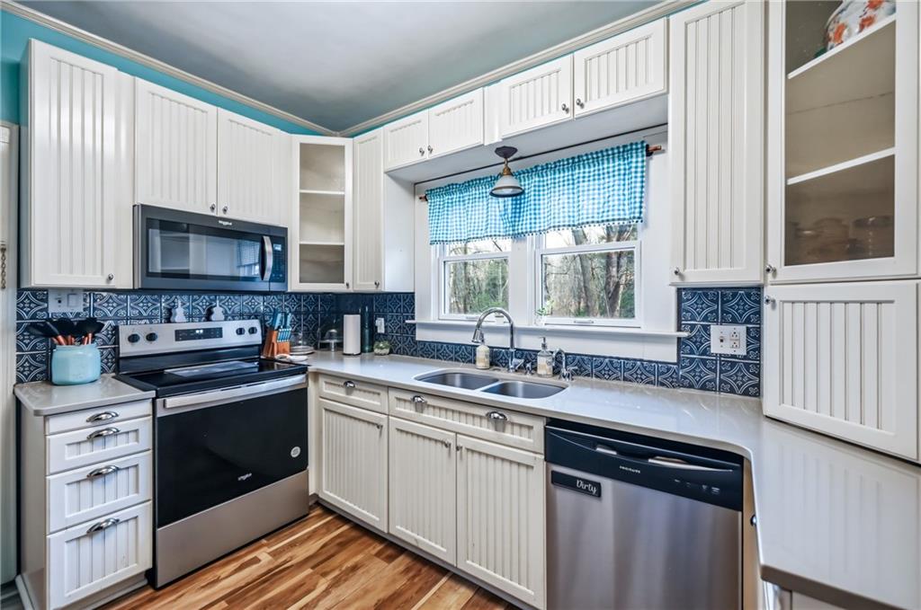 2411 Graceland Road New Castle, PA 16105 - Photo 14 of 50 a kitchen with a sink stove and microwave