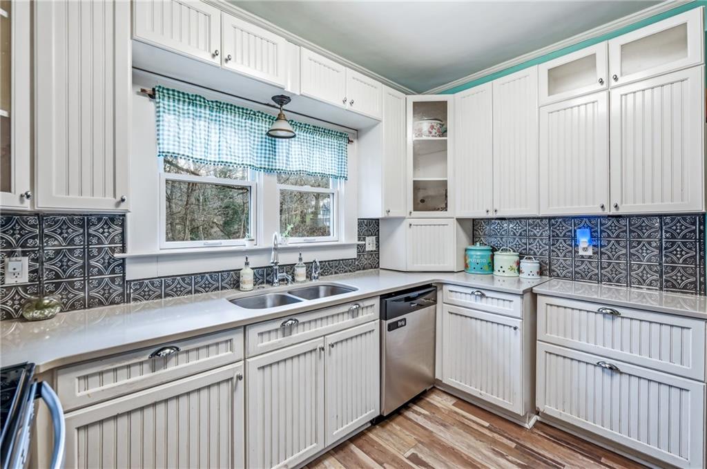 2411 Graceland Road New Castle, PA 16105 - Photo 15 of 50 a kitchen with stainless steel appliances granite countertop a sink stove and cabinets