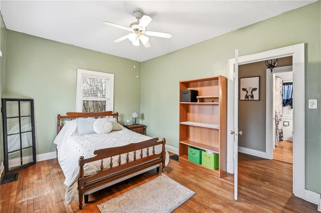 2411 Graceland Road New Castle, PA 16105 - Photo 16 of 50 a bedroom with a bed and a chandelier