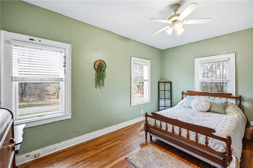 2411 Graceland Road New Castle, PA 16105 - Photo 17 of 50 a bedroom with a bed window and a chandelier