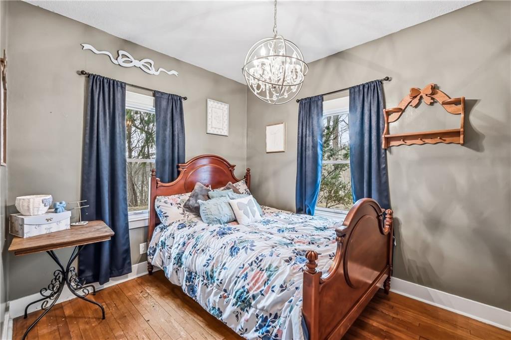 2411 Graceland Road New Castle, PA 16105 - Photo 19 of 50 a bedroom with a bed and a chandelier